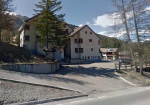 a house on the side of a road at Pordoi H10 - with SAUNA in Alba di Canazei