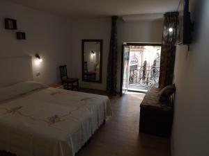 A bed or beds in a room at Via Roma 28