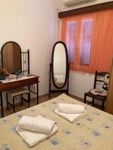 Posteľ alebo postele v izbe v ubytovaní AGKYRA Rooms (Love)