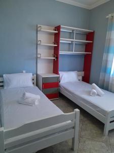 A bed or beds in a room at Niki House