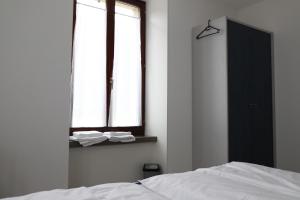 Voodi või voodid majutusasutuse L'auberge de Noiraigue toas