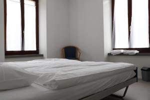 Voodi või voodid majutusasutuse L'auberge de Noiraigue toas