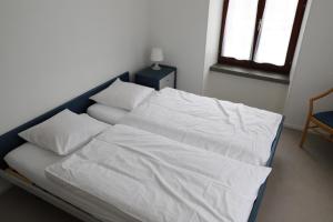 Voodi või voodid majutusasutuse L'auberge de Noiraigue toas