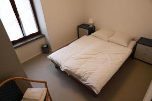Voodi või voodid majutusasutuse L'auberge de Noiraigue toas