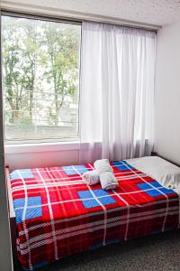 Postel nebo postele na pokoji v ubytování El Cable Hostal