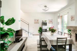 a kitchen and dining room with a table and chairs at Montorfano By The Lake - My Home In Como in Montorfano