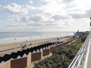 a view of the beach from the balcony of a beach house at Ryburn Lodge in Bridlington