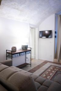 TV a/nebo společenská místnost v ubytování La Rosa