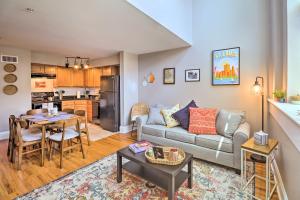 a living room with a couch and a table at St Louis Apartment Walk to Eating and Entertainment in Tower Grove