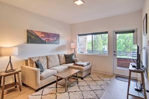 a living room with a couch and a table at Cozy Bozeman Condo with Proximity to Downtown! in Bozeman