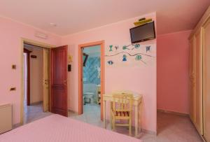 TV a/nebo společenská místnost v ubytování Hotel Solanas