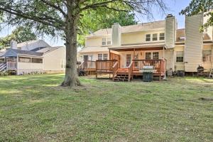 a house with a yard with a tree at Modern Nashville Townhome Large Yard and Deck! in Nashville
