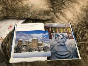 two books sitting on top of a bed at Fiordaliso in Aosta