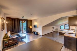 a large living room with a couch and a table at Black Box Studio in Smolyan