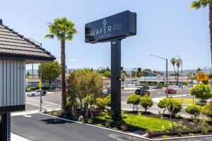 a sign for a water hotel on a street at WAFER 450 Hotel in Santa Clara