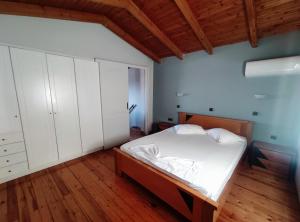 Postel nebo postele na pokoji v ubytování Athena Hotel