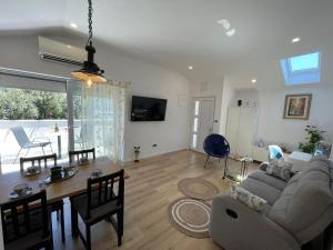 a living room with a couch and a table at Apartman Ivana in Split