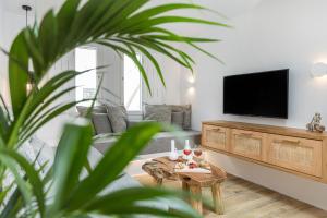 Televízia a/alebo spoločenská miestnosť v ubytovaní Naxian Icon Luxury Residence 3
