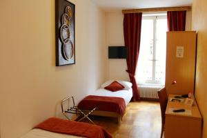 Posteľ alebo postele v izbe v ubytovaní Hostellerie du XVI Siècle