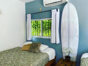 Cama o camas de una habitación en Wandering Monkey Guesthouse