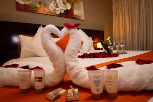 Postelja oz. postelje v sobi nastanitve SM Hotel