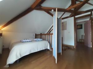 Ένα ή περισσότερα κρεβάτια σε δωμάτιο στο Gîte Les Grandes Vacances à Morée 41