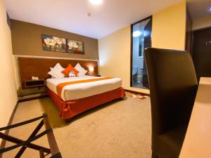 Postelja oz. postelje v sobi nastanitve SM Hotel