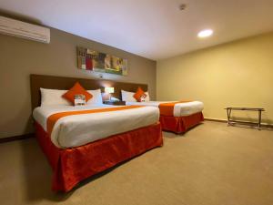 Postelja oz. postelje v sobi nastanitve SM Hotel