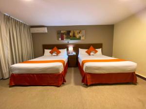 Postelja oz. postelje v sobi nastanitve SM Hotel