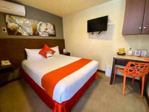 Postelja oz. postelje v sobi nastanitve SM Hotel