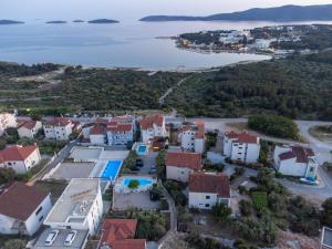 an aerial view of a small town next to the water at Sun gardens in Šibenik