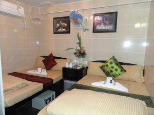 Llit o llits en una habitació de Dhillon Hotel -Guest House & Hostel