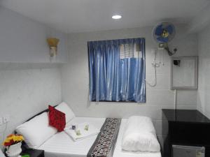 Llit o llits en una habitació de Dhillon Hotel -Guest House & Hostel