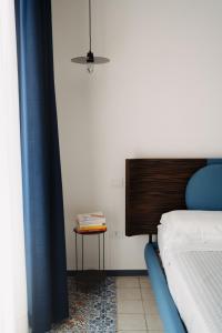 מיטה או מיטות בחדר ב-La Dimora dei WaLori