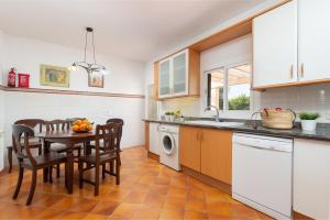 A kitchen or kitchenette at Can Rafelino, pool and relax