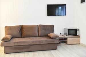 Televízia a/alebo spoločenská miestnosť v ubytovaní Apartments Villa Lucky