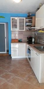 Kuchyňa alebo kuchynka v ubytovaní House Isabella