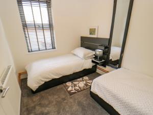 Posteľ alebo postele v izbe v ubytovaní 23a High Street