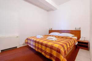 Postel nebo postele na pokoji v ubytování Hotel Posejdon