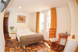 Postel nebo postele na pokoji v ubytování Astorga Hotel Arequipa