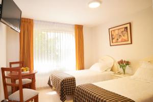 เตียงในห้องที่ Astorga Hotel Arequipa