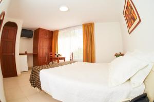 Postel nebo postele na pokoji v ubytování Astorga Hotel Arequipa