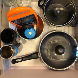 a bunch of kitchen utensils sitting on a counter at Studija JV36 in Juodkrantė +4 photos
