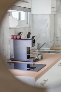 Kuchyň nebo kuchyňský kout v ubytování Maya apartments Hanioti