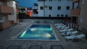 The swimming pool at or close to Apartments Villa Lucky