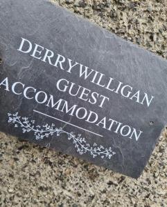 a sign that reads durham gucci accomodation at Derrywilligan Guest Accommodation in Bessbrook