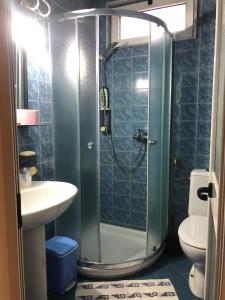 a bathroom with a shower and a sink at VILLA PEPETO Durres Albania in Durrës