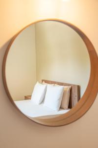 A bed or beds in a room at Μελίτη Pelion Luxury Living