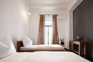 Postel nebo postele na pokoji v ubytování Arena Hotel Samorin