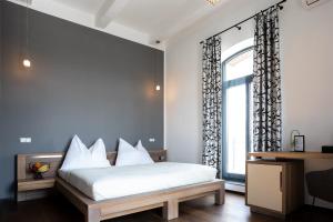 Postel nebo postele na pokoji v ubytování Arena Hotel Samorin
